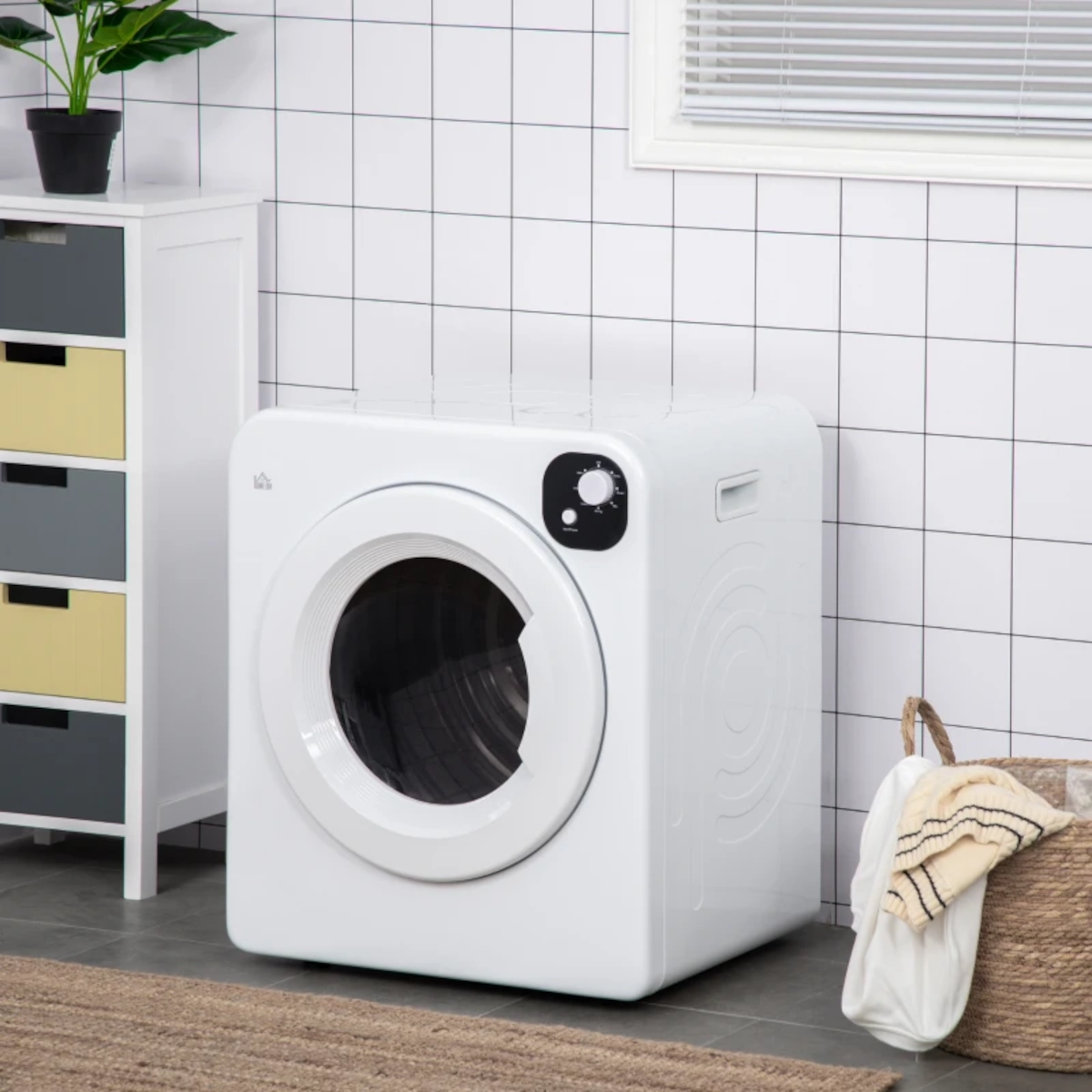 Sèche-linge à chargement frontal blanc dans une buanderie carrelée avec un panier de rangement.