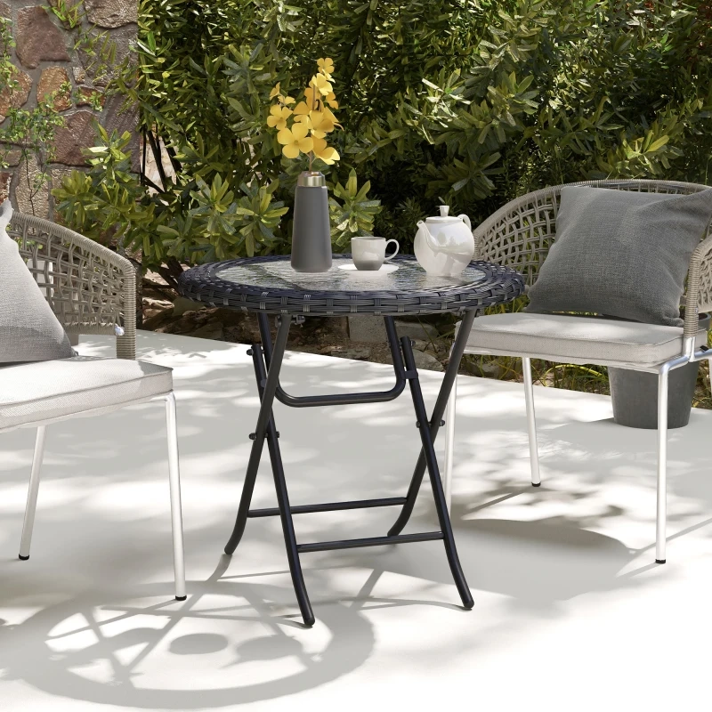 Table pliante ronde élégante en verre avec cadre métallique décoratif, parfaite pour les terrasses.